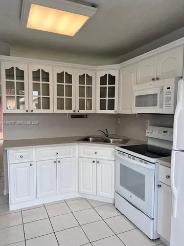 a view of balcony and kitchen