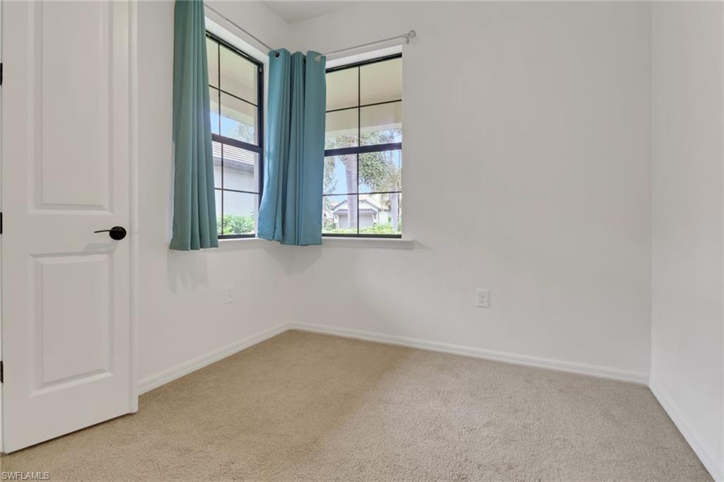 20281 Corkscrew Shores Boulevard Estero, FL 33928 - Photo 18 of 40 an empty room with windows