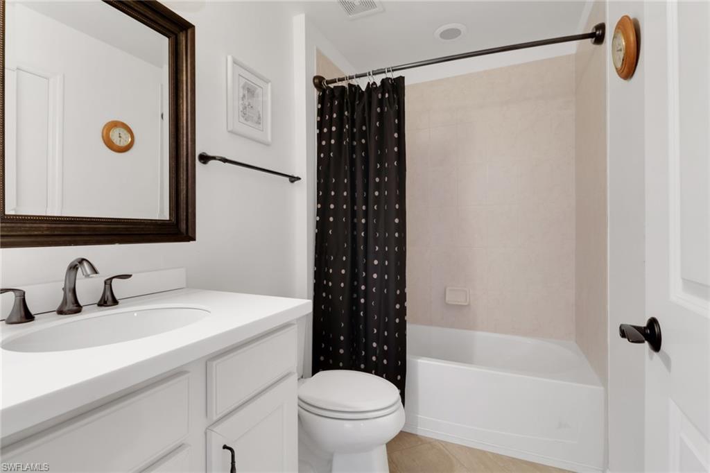 20281 Corkscrew Shores Boulevard Estero, FL 33928 - Photo 21 of 40 a bathroom with a sink and a mirror