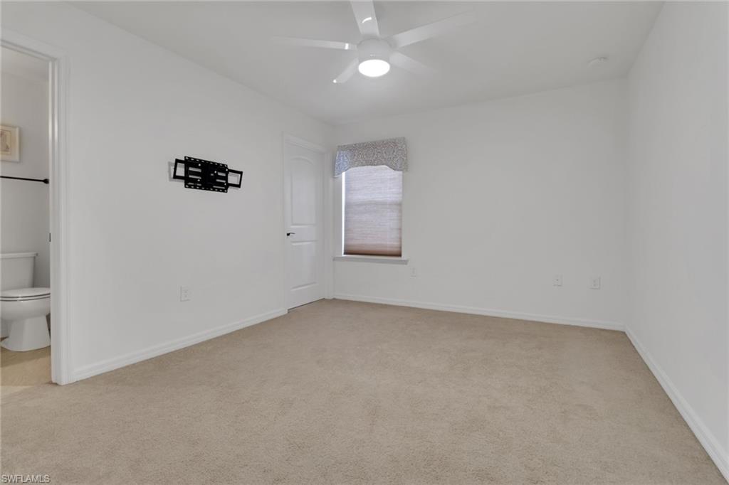 20281 Corkscrew Shores Boulevard Estero, FL 33928 - Photo 22 of 40 an empty room with a window
