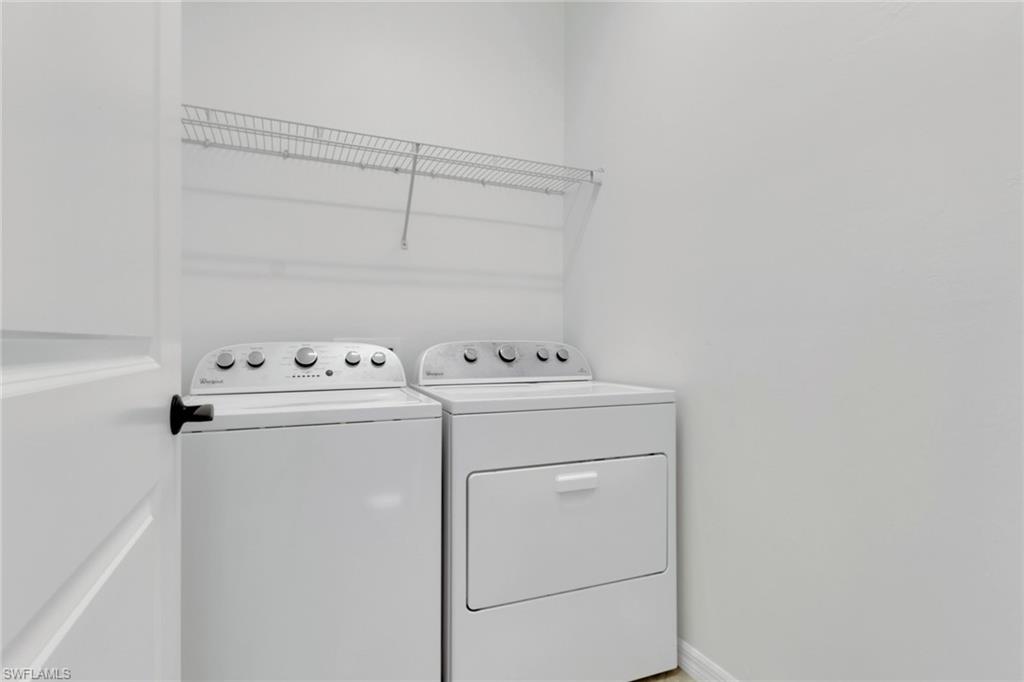 20281 Corkscrew Shores Boulevard Estero, FL 33928 - Photo 24 of 40 a utility room with dryer and washer