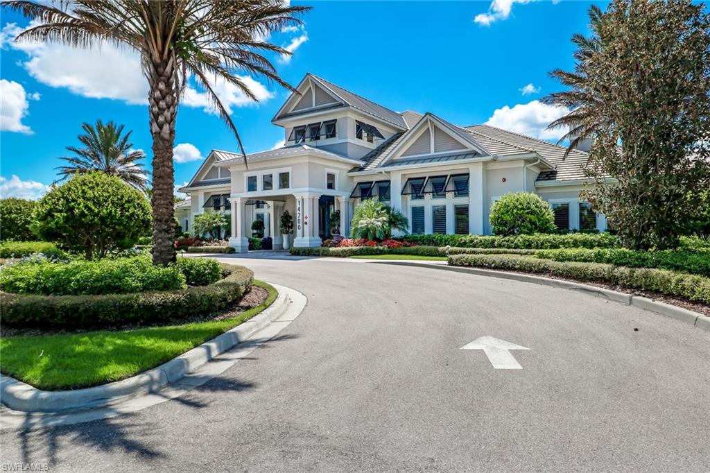 20281 Corkscrew Shores Boulevard Estero, FL 33928 - Photo 29 of 40 a front view of a house with a garden and plants