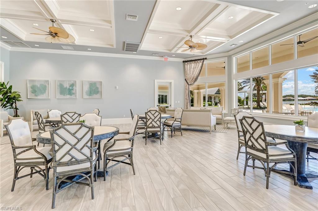 20281 Corkscrew Shores Boulevard Estero, FL 33928 - Photo 31 of 40 a view of a dining room with furniture window and wooden floor