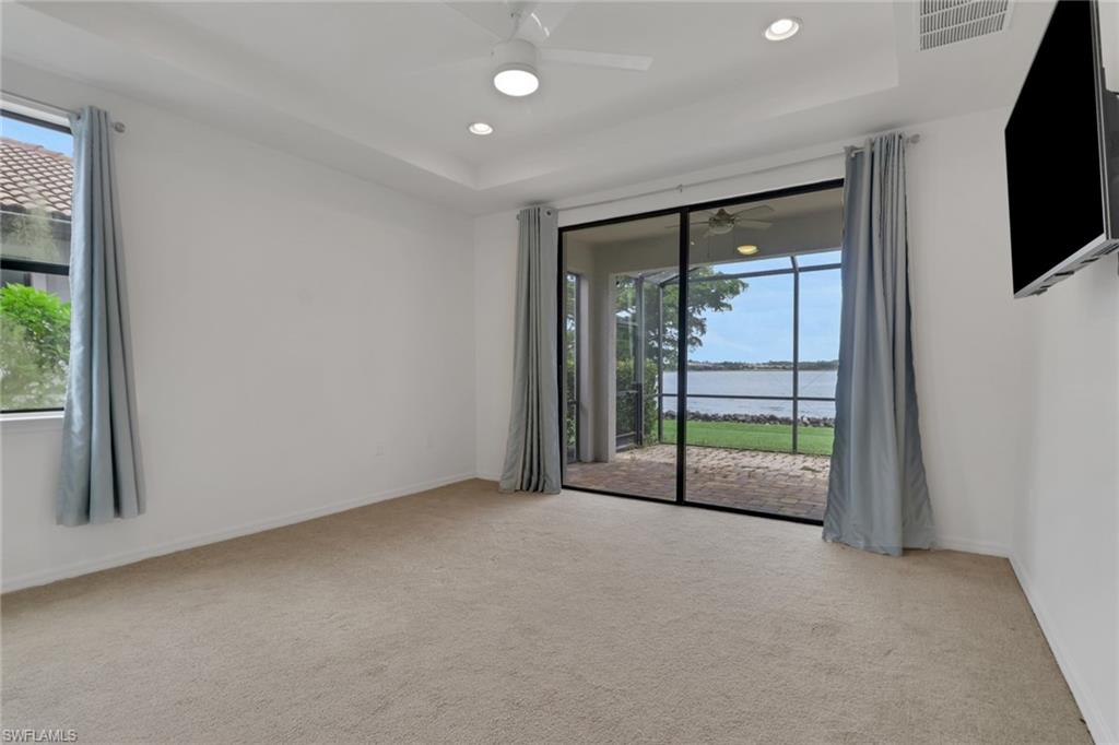 20281 Corkscrew Shores Boulevard Estero, FL 33928 - Photo 10 of 40 a view of an empty room with a sliding door
