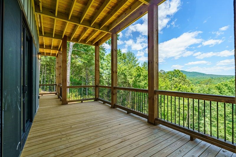 216 Old Orchard Road Ellijay, GA 30536 - Photo 5 of 59 a view of a room with wooden floor and city view