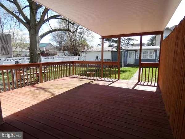 a view of a deck with a yard