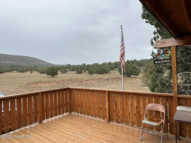 a view of a wooden deck and a lake view