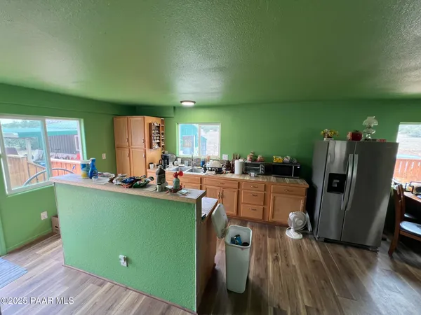 a room with lots of furniture and a wooden floor