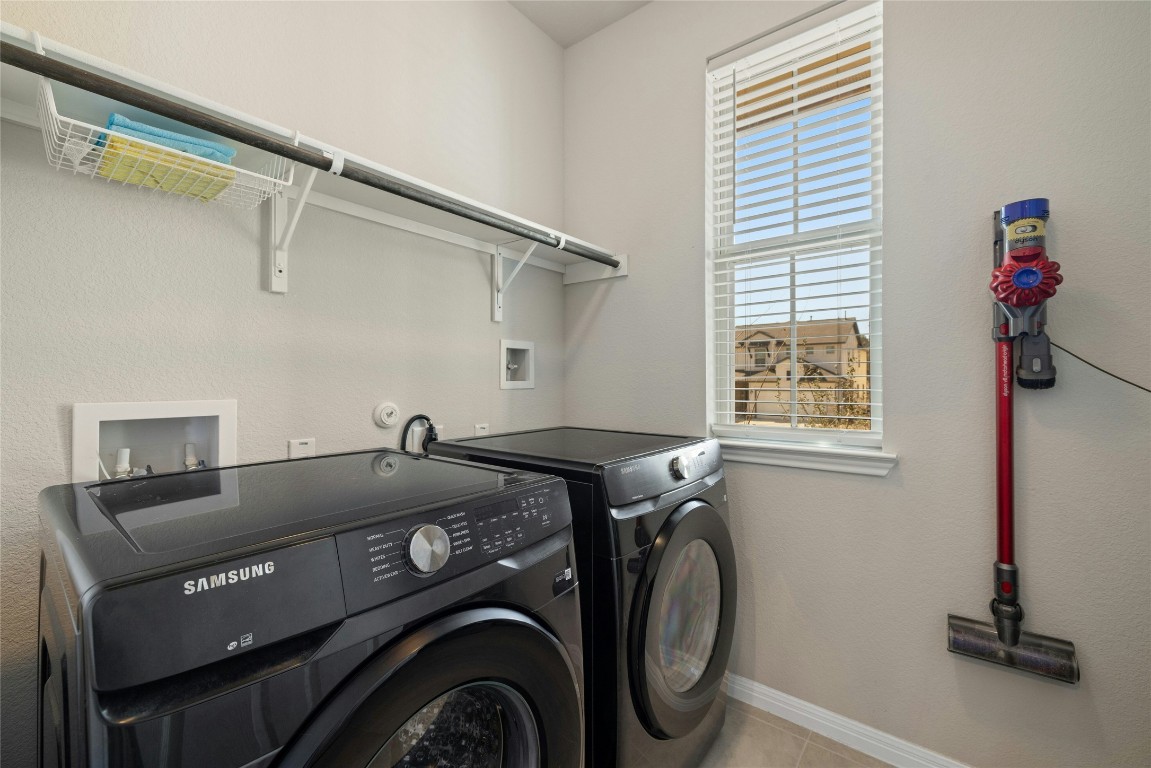 436 Staunton Drive Leander, TX 78641 - Photo 28 of 39 a utility room with dryer and washer