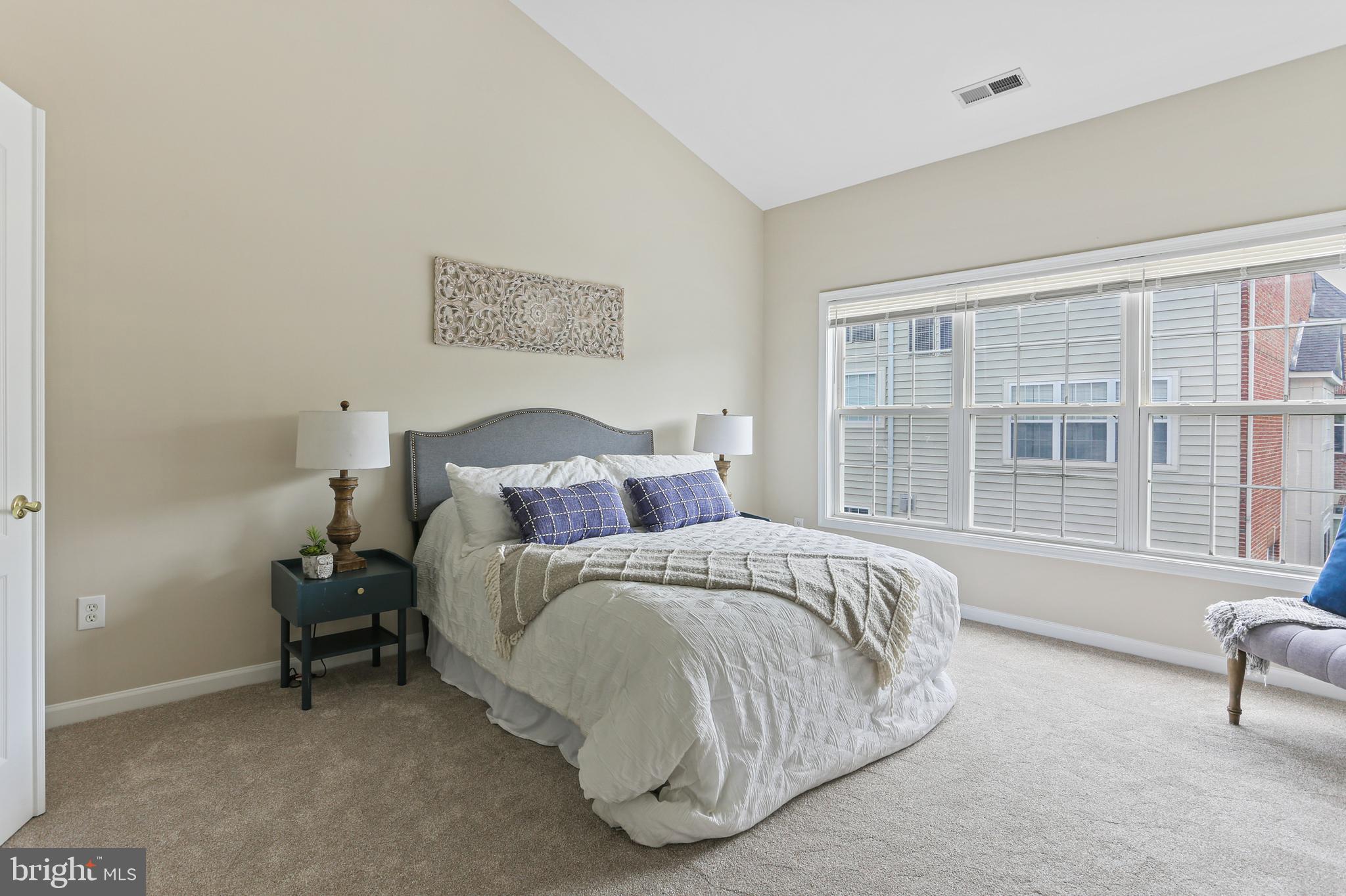 10232 Rutland Round Road, Unit 24 Columbia, MD 21044 - Photo 13 of 31 a spacious bedroom with a bed and a window