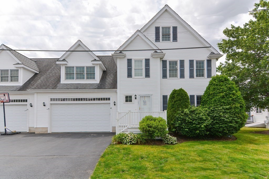 237 Pleasant Street, Unit 237 Norwood, MA 02062 - Photo 1 of 40 a view of a yard in front of house