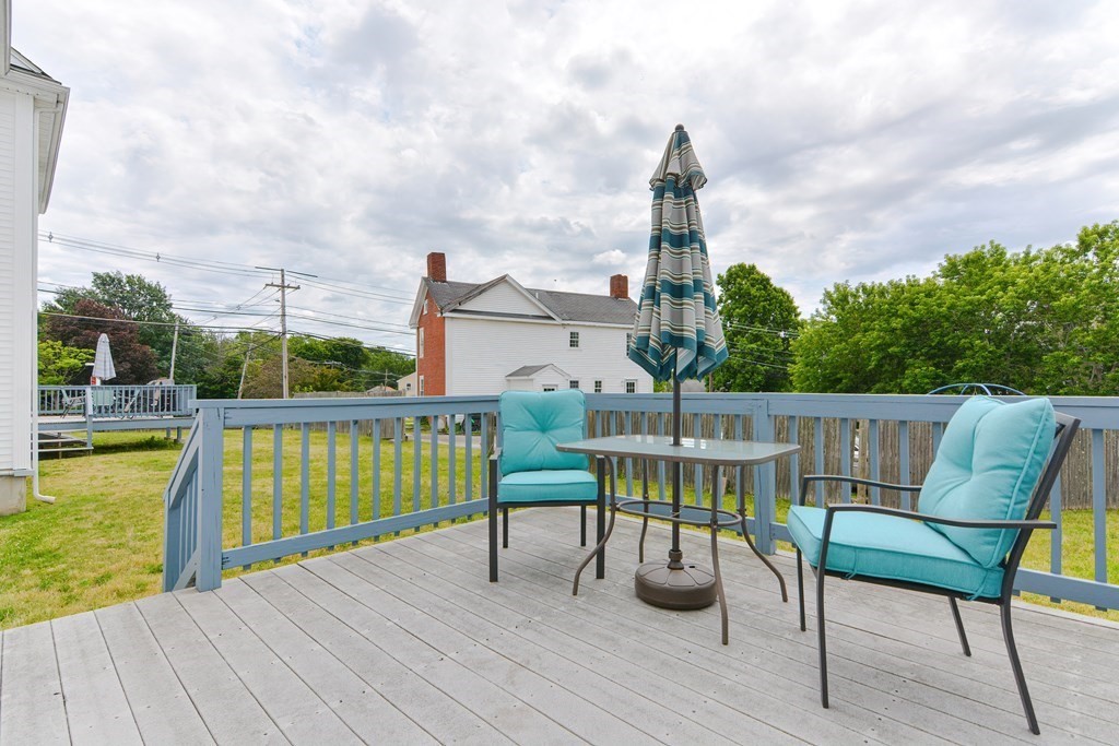 237 Pleasant Street, Unit 237 Norwood, MA 02062 - Photo 36 of 40 a view of a chairs on the deck