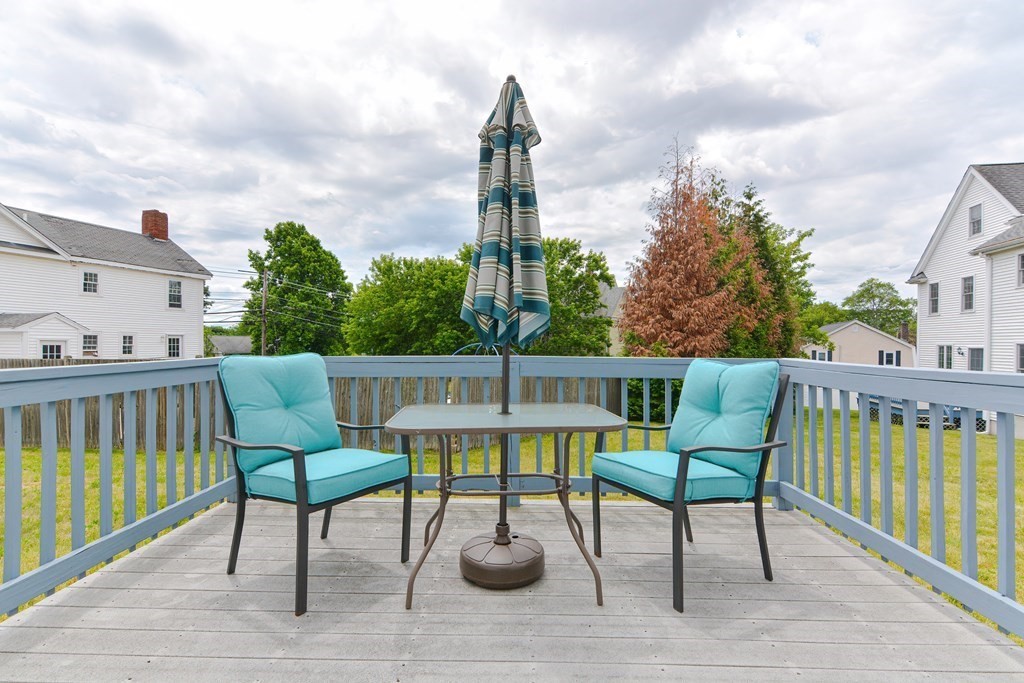 237 Pleasant Street, Unit 237 Norwood, MA 02062 - Photo 38 of 40 a view of a chairs and tables in the balcony
