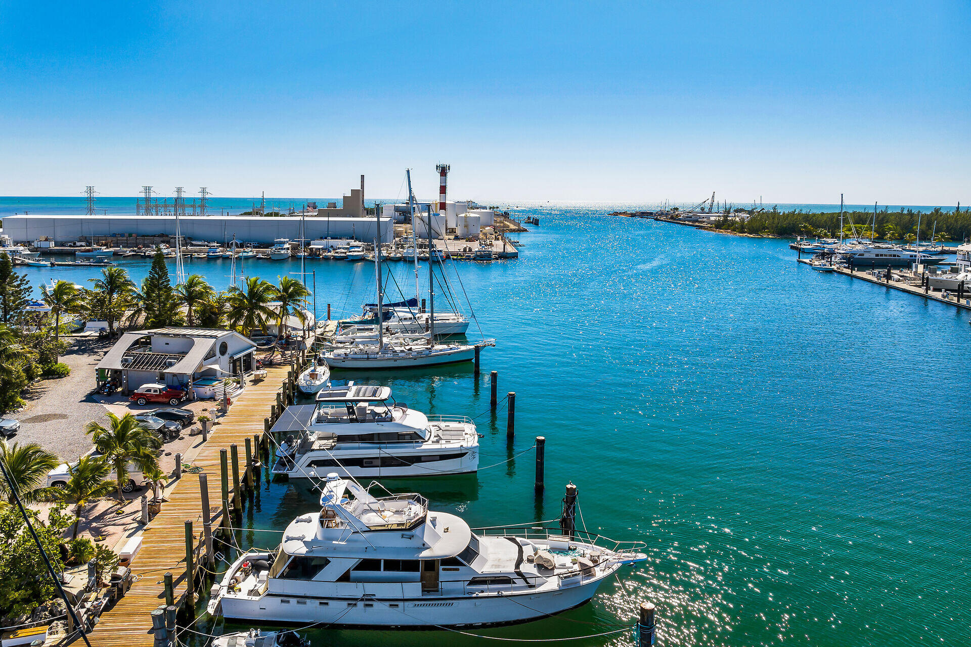 6810 Front Street, Unit SLL1C AND SLL1D Stock Island, FL 33040 - Photo 6 of 25 a backyard of a house with lots of green space and seating