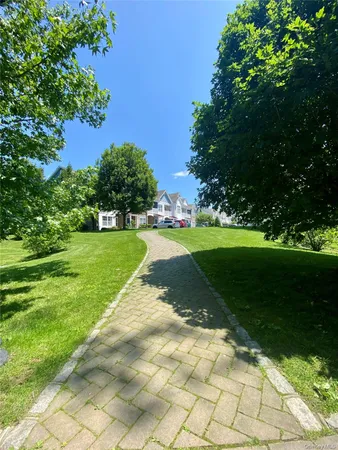 a view of a park with plants and trees