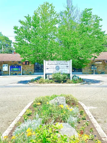 a view of street with houses and trees in the background