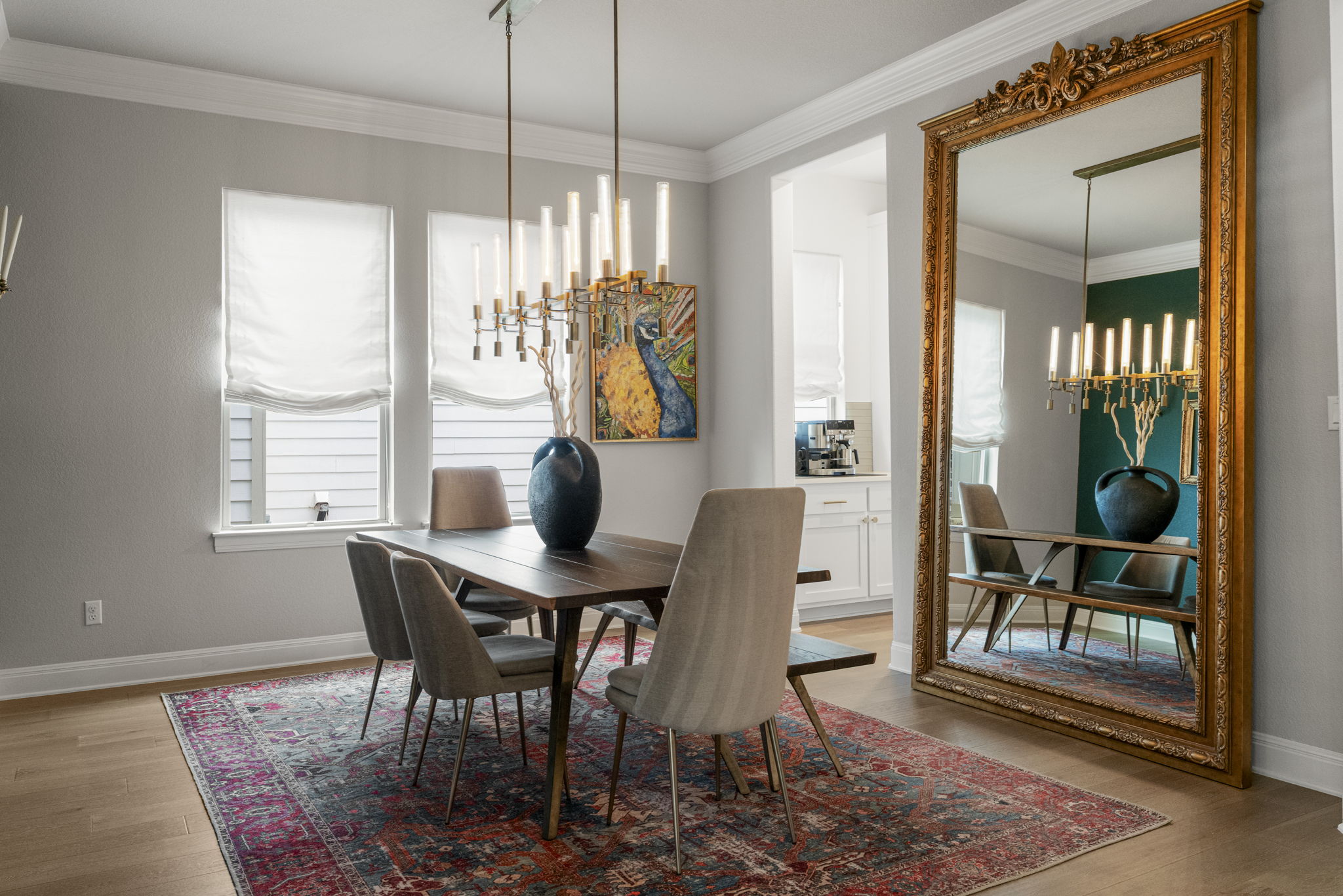 288 Hazy Hills Loop Dripping Springs, TX 78620 - Photo 6 of 40 The formal dining space has refined finishes, decorative moldings, and a seamless connection to the kitchen and scullery.