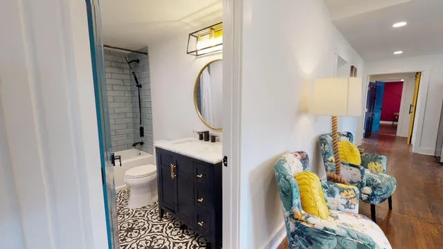 a bathroom with a sink toilet and shower