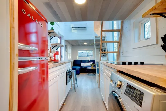 a kitchen that has a lot of cabinets in it