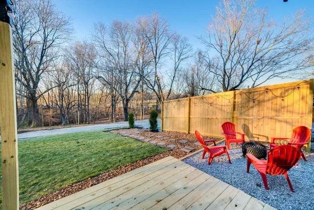 a view of a backyard with sitting area