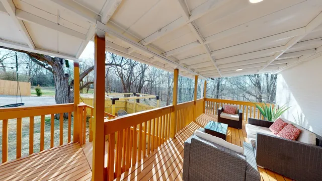 a view of a two chairs in the balcony
