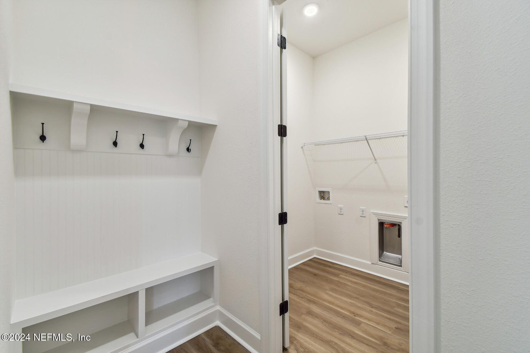 5608 Pathfinder Road Jacksonville, FL 32224 - Photo 24 of 36 a view of walk in closet with wooden floor
