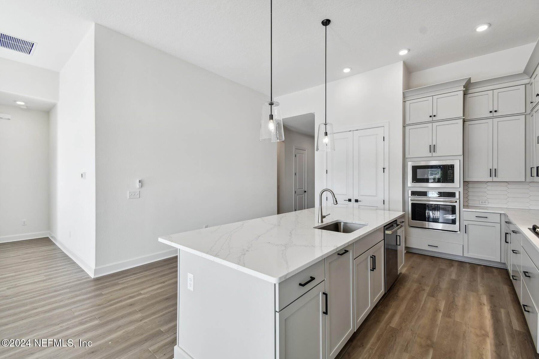 5608 Pathfinder Road Jacksonville, FL 32224 - Photo 6 of 36 a kitchen that has a lot of cabinets in it