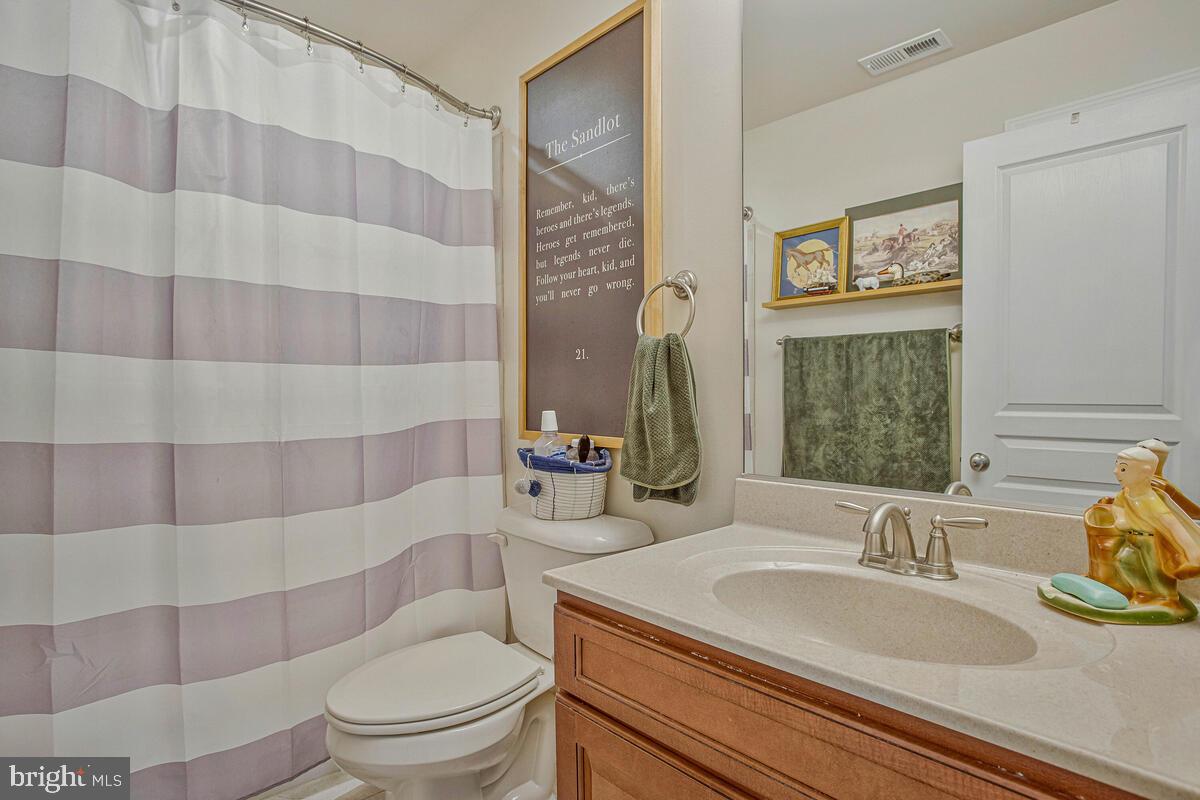 54 Simmons Ridge Road Prince Frederick, MD 20678 - Photo 28 of 55 a bathroom with a sink toilet and shower