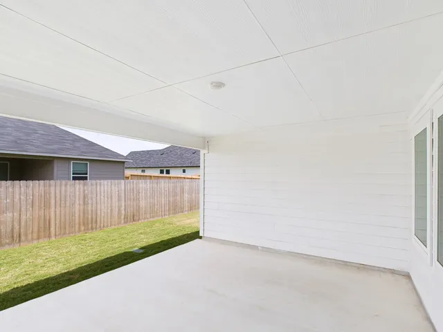 a view of a backyard with a small cabin