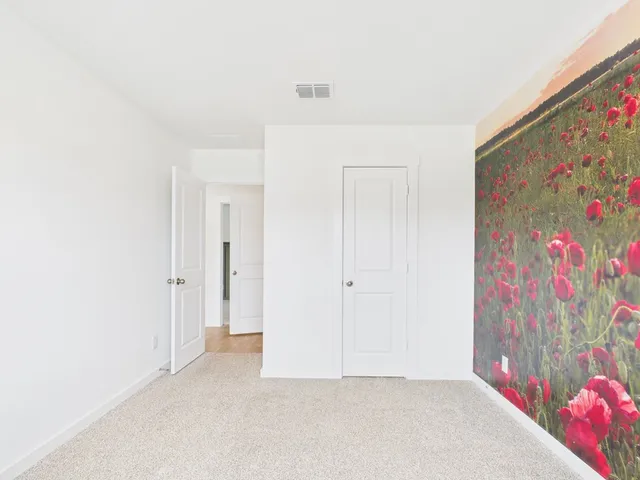a view of hallway with painting on the wall