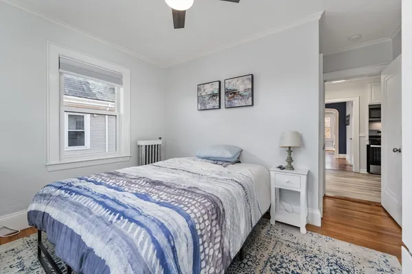 a bedroom with bed and window