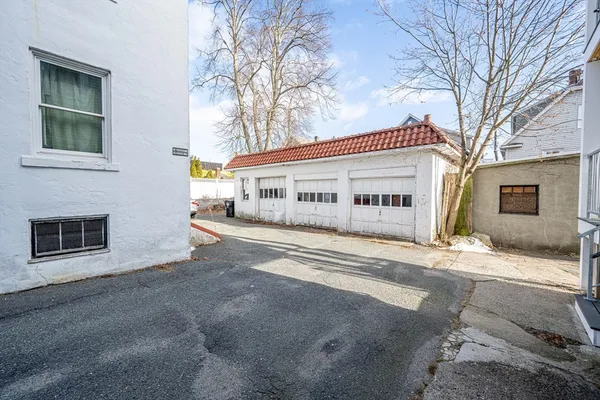 a view of a house with a yard and garage