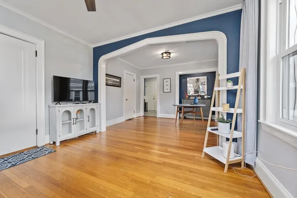 a view of a livingroom with furniture and a flat screen tv