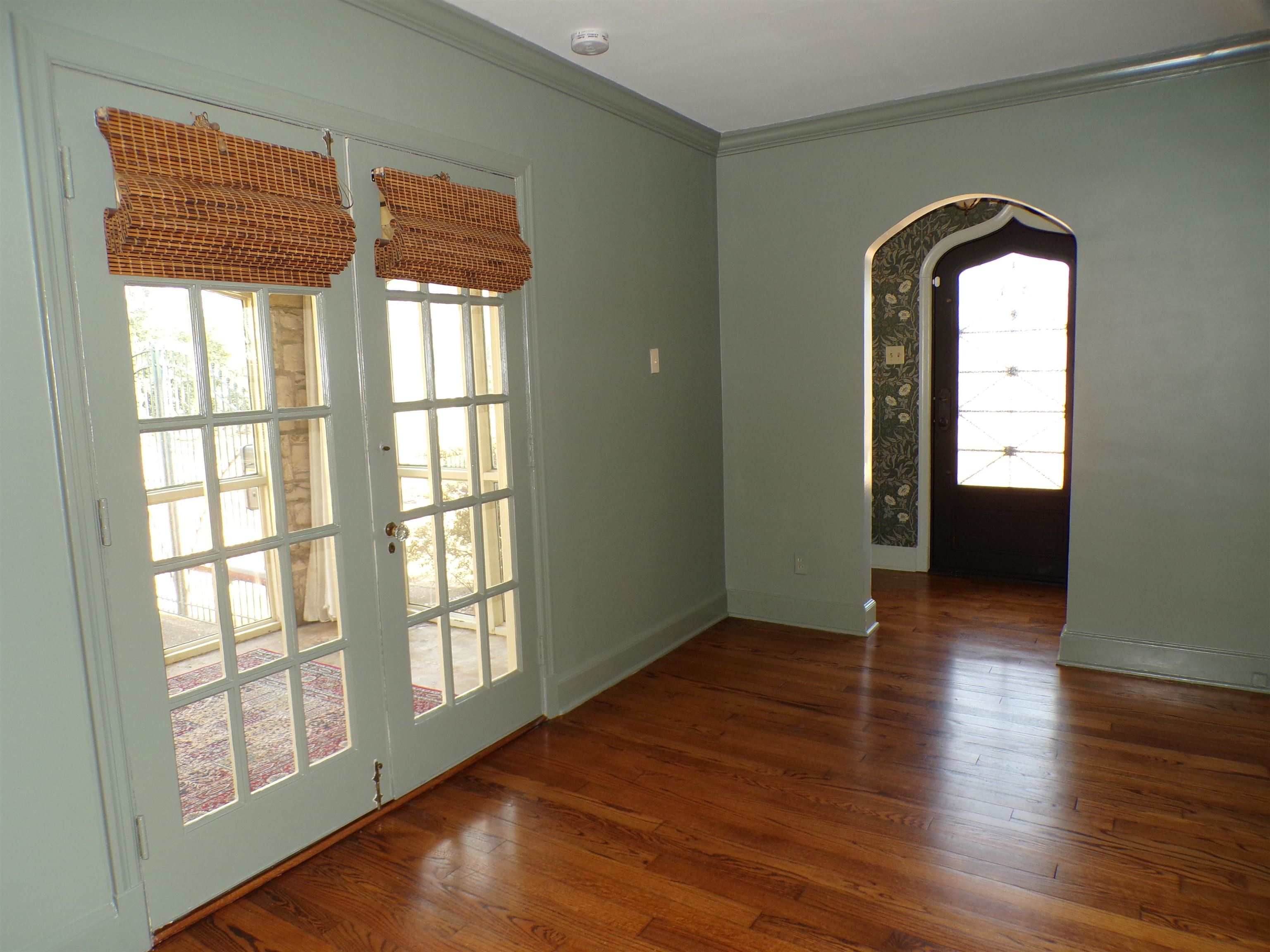 527 South Goodlett Street Memphis, TN 38117 - Photo 4 of 34 Entry is a Custom Iron Door; Double Doors Open to the Sunroom