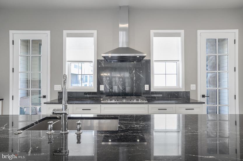 22170 Penelope Heights Terrace Ashburn, VA 20148 - Photo 14 of 61 a kitchen with granite countertop a sink a stove and cabinets