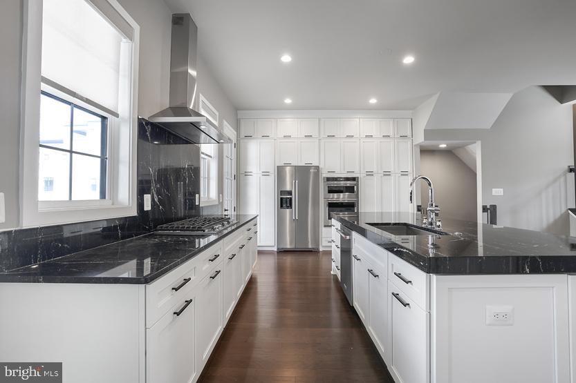 22170 Penelope Heights Terrace Ashburn, VA 20148 - Photo 15 of 61 a large kitchen with stainless steel appliances granite countertop a stove a sink and a refrigerator