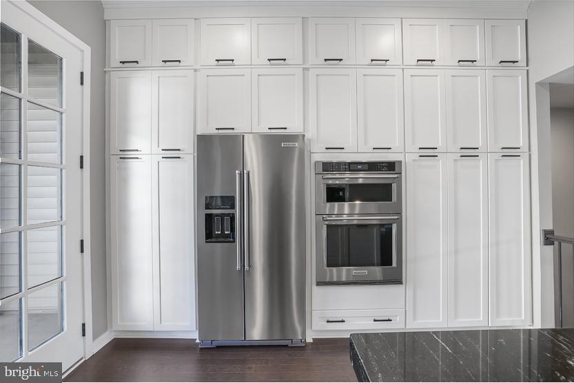 22170 Penelope Heights Terrace Ashburn, VA 20148 - Photo 16 of 61 a view of kitchen with white cabinets and refrigerator