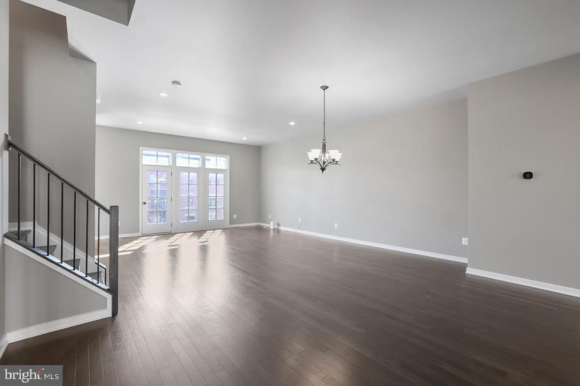 22170 Penelope Heights Terrace Ashburn, VA 20148 - Photo 17 of 61 a view of an empty room with wooden floor and a window