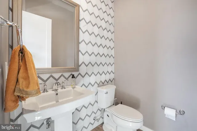 a spacious bathroom with a double vanity sink shower and mirror