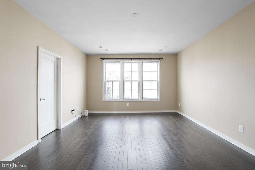 22170 Penelope Heights Terrace Ashburn, VA 20148 - Photo 26 of 61 an empty room with wooden floor and windows