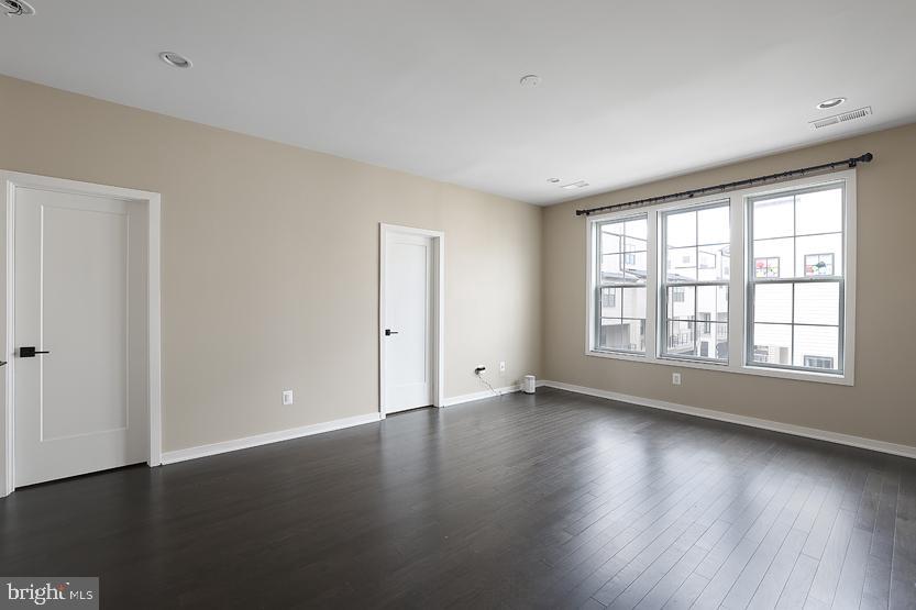 22170 Penelope Heights Terrace Ashburn, VA 20148 - Photo 27 of 61 an empty room with wooden floor and windows