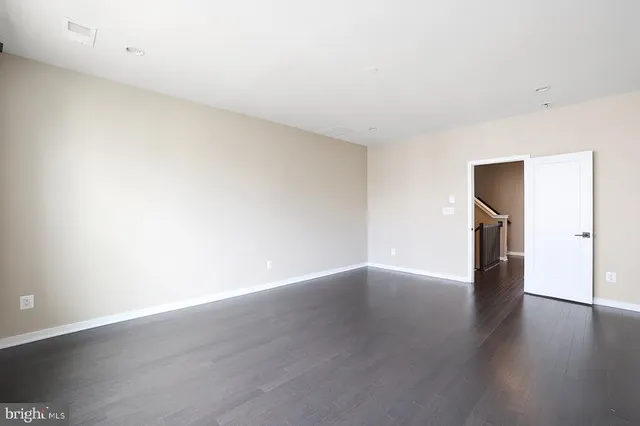 a large bathroom with a large mirror vanity and shower