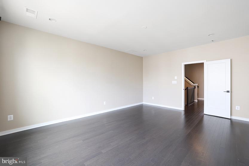 22170 Penelope Heights Terrace Ashburn, VA 20148 - Photo 28 of 61 a view of an empty room with wooden floor and a window