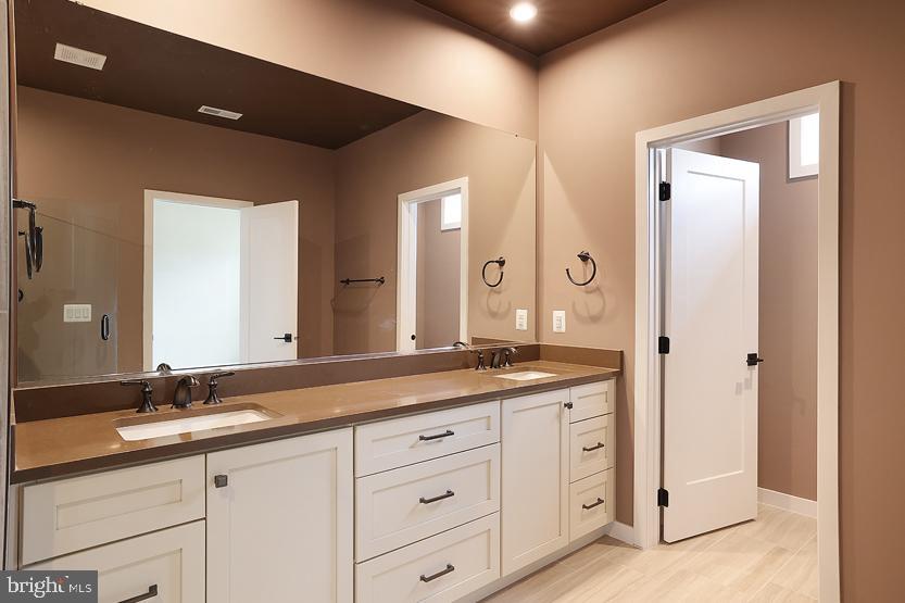 22170 Penelope Heights Terrace Ashburn, VA 20148 - Photo 32 of 61 a bathroom with a granite countertop sink mirror and double