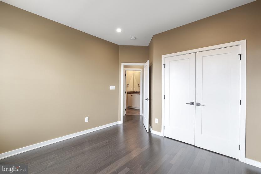 22170 Penelope Heights Terrace Ashburn, VA 20148 - Photo 36 of 61 a view of an empty room with wooden floor