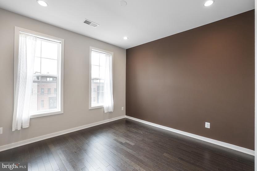 22170 Penelope Heights Terrace Ashburn, VA 20148 - Photo 37 of 61 an empty room with wooden floor and windows