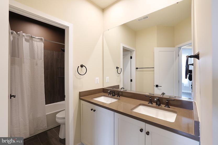 22170 Penelope Heights Terrace Ashburn, VA 20148 - Photo 39 of 61 a bathroom with a granite countertop sink and a mirror