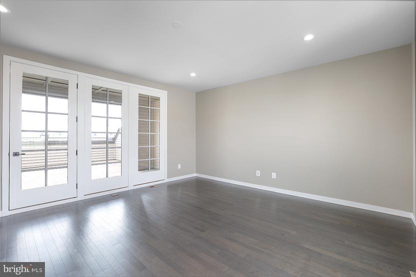 22170 Penelope Heights Terrace Ashburn, VA 20148 - Photo 41 of 61 a view of an empty room with wooden floor and a window