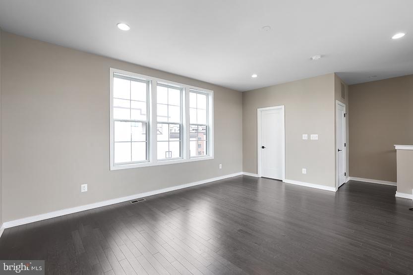 22170 Penelope Heights Terrace Ashburn, VA 20148 - Photo 42 of 61 an empty room with wooden floor and windows