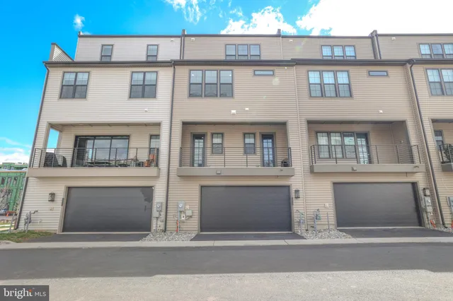 a picture of a bench in front of a wall